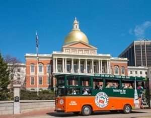 Tour bus in front of the Massachusetts State House