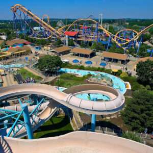 Aerial view of vibrant amusement park with roller coasters